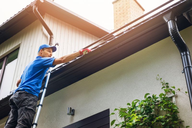 Team Installing Gutters on a Home